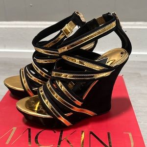 Black and gold wedge heels